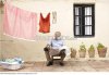 man_reading_newspaper_on_patio_600-01043350.jpg