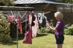 82335556-woman-hanging-washing-out-to-dry-on-a-clothes-line.jpg